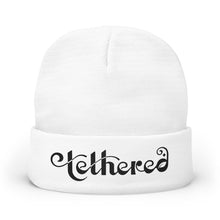 Load image into Gallery viewer, Embroidered Tethered 2025 Knit Beanie — Cozy Winter Hat with Script Embroidery